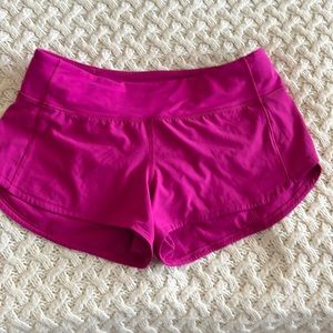 Lulu Lemon Fuschia short length running shorts, zipper in back, size 4.